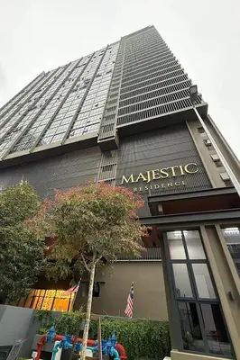 a large building with a sign on the side of it at Majestic Residence KLCC by Luxe in Gua Sai