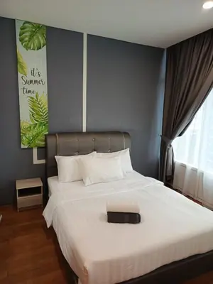 a bedroom with a large white bed with a black tray on it at Sky suites klcc by Ryan in Kuala Lumpur