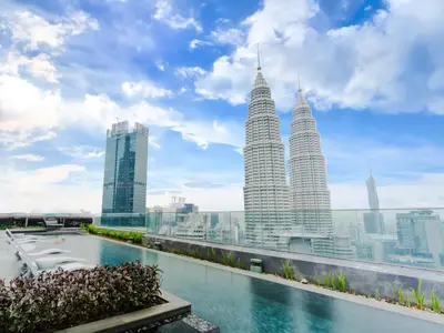 a view of the petronas twin towers from the rooftop of a building at Star KLCC Cosy Twin Tower Suite 2-3pax in Kuala Lumpur