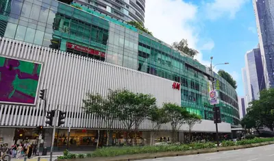 a large building with people walking in front of it at Star KLCC Cosy Twin Tower Suite 2-3pax in Kuala Lumpur