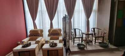 a living room with two chairs and a table at Star KLCC Cosy Twin Tower Suite 2-3pax in Kuala Lumpur