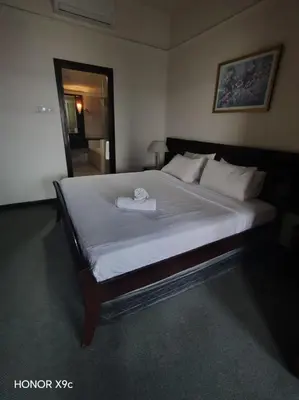 a bedroom with a large bed with a towel on it at Healthy suite At Times Square KL in Kuala Lumpur