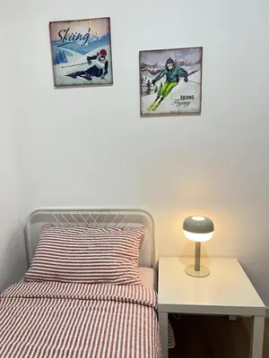 a bedroom with two posters on the wall and a bed at Kuala Lumpur M Vertica Retro 3BR with Car park in Kuala Lumpur
