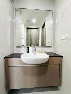 a bathroom with a sink and a mirror at Agile Bukit Bintang TRX By Glanza Suites in Kuala Lumpur