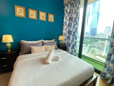 a bedroom with a large white bed with a window at Opus Residence 1R1B Pinwu 118 view|Balcony|LRT in Kuala Lumpur