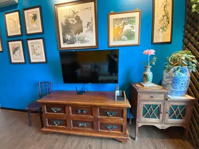 a living room with a tv and a wooden dresser at Opus Residence 1R1B Pinwu 118 view|Balcony|LRT in Kuala Lumpur