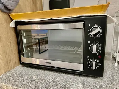 a microwave oven sitting on top of a counter at Robertson 1R1B Pinwu Bkt Bintang|Chinatown|LRT in Kuala Lumpur