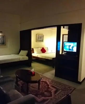 a living room with a couch and a tv in a room at Town suites Times Square in Kuala Lumpur