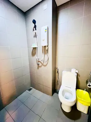 a bathroom with a toilet in a stall at Mercu Summer suites KLCC by Classy in Kuala Lumpur