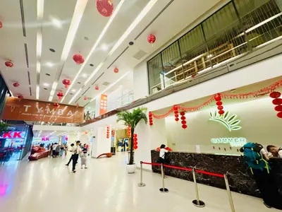 a shopping mall with christmas decorations and people in it at Mercu Summer suites KLCC by Classy in Kuala Lumpur