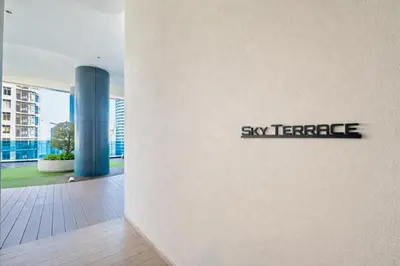 a sign that says sky terrace on the side of a building at Eaton Residences KL City Center in Kuala Lumpur