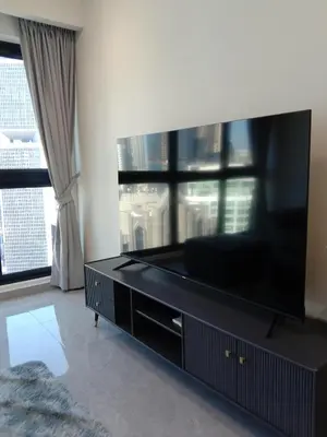 a living room with a large flat screen tv at Agile Bukit Bintang Sleepy in Kuala Lumpur