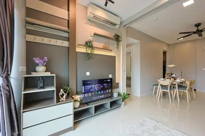 a living room with a television and a dining room at Elegant Skyline Suite # Datum Jelatek near KLCC in Kampong Datok Keramat