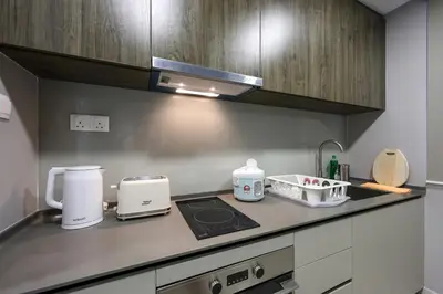 a kitchen with a counter top with a appliance on it at Elegant Skyline Suite # Datum Jelatek near KLCC in Kampong Datok Keramat