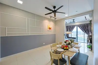 a dining room with a table and a ceiling fan at Elegant Skyline Suite # Datum Jelatek near KLCC in Kampong Datok Keramat
