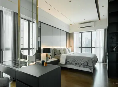 a bedroom with a bed and a desk and some windows at Prime Location KLCC - next to MRT in Kuala Lumpur