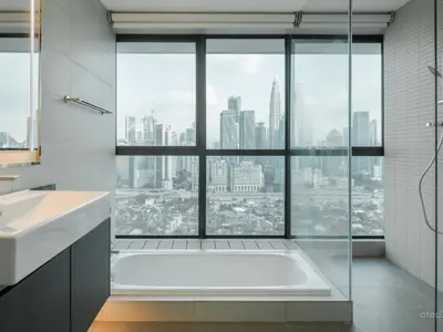 a bathroom with a bath tub and a large window at Prime Location KLCC - next to MRT in Kuala Lumpur