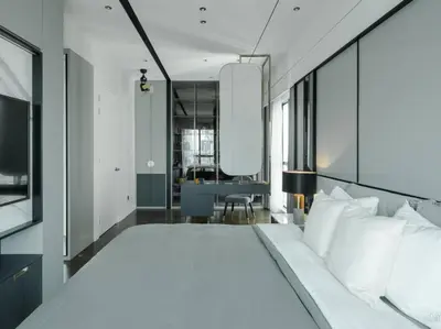 a bedroom with a large white bed and a desk at Prime Location KLCC - next to MRT in Kuala Lumpur