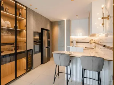 a kitchen with a counter and two bar stools at Prime Location KLCC - next to MRT in Kuala Lumpur