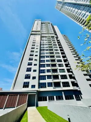 a tall white apartment building with a blue sky at The Agile Residence By Signature in Kuala Lumpur