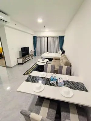 a living room with a bed and a couch at Agile suits of Kuala Lumpur in Kuala Lumpur