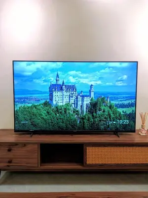 a flat screen tv sitting on top of a wooden entertainment center at Agile suits of Kuala Lumpur in Kuala Lumpur