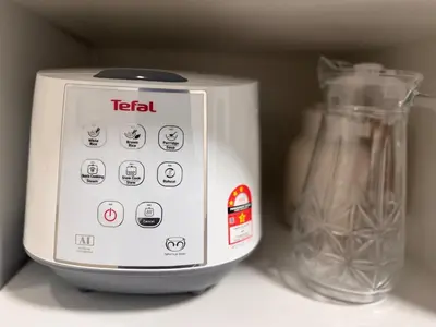 a toaster sitting on a counter next to a glass jar at 3 Bedrooms KLCC View PlazaRah,Kg Baru next to Rembayung in Kuala Lumpur
