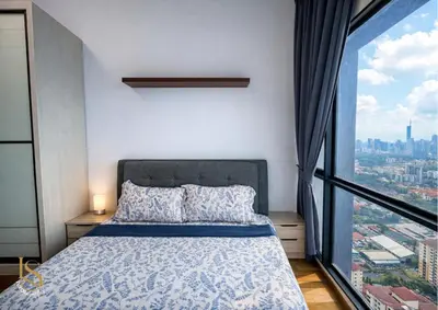 a bedroom with a bed and a large window at LUXORA SUITE's REIZZ RESIDENCE in Kuala Lumpur