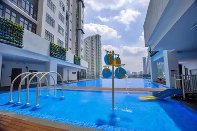 a pool with a water slide in a building at Skyline Kuala Lumpur near Lalaport by Cityscape in Kuala Lumpur