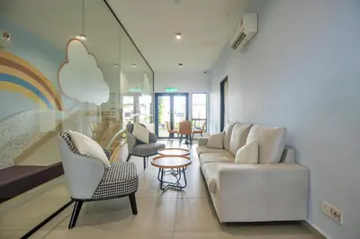 a living room with a couch and chairs and a table at Skyline Kuala Lumpur near Lalaport by Cityscape in Kuala Lumpur