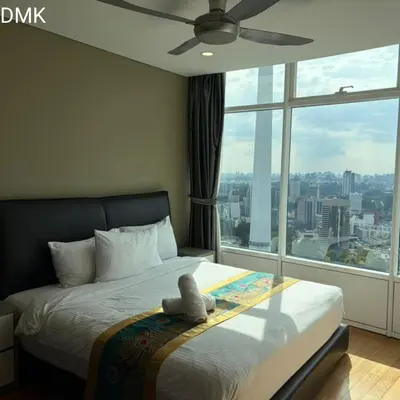 a bedroom with a bed with a large window at vortex luxury APATMENT BY FRINDSHIP in Kuala Lumpur