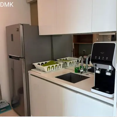 a kitchen with a sink and a refrigerator at vortex luxury APATMENT BY FRINDSHIP in Kuala Lumpur