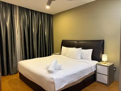 a bedroom with a large bed with white sheets at vortex luxury APATMENT BY FRINDSHIP in Kuala Lumpur