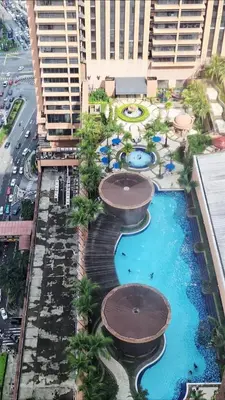 an aerial view of a resort with two pools at Time Square Mountain View Apartment KL in Kuala Lumpur