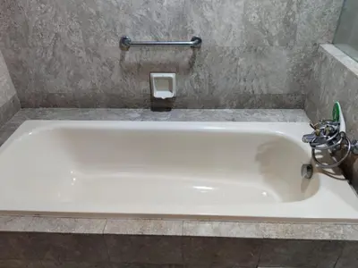 a white bath tub with a faucet in a bathroom at Time Square Mountain View Apartment KL in Kuala Lumpur