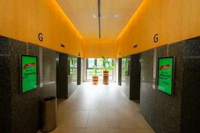 a hallway in a building with signs on the wall at M Arisa Sentul by A&T in Kuala Lumpur