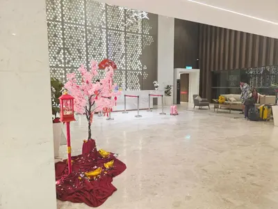 a lobby with a pink tree in the middle of a room at Kuala Lumpur Suites Quill in Kuala Lumpur