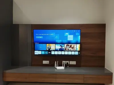 a flat screen tv sitting on top of a entertainment center at Victoria Suites Quill Residence KLCC in Kuala Lumpur