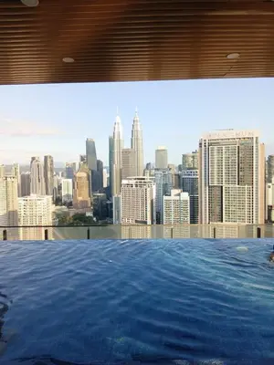 a view of a city skyline from a swimming pool at Infinitum suites KLCC Sky Pool by EXA in Kuala Lumpur