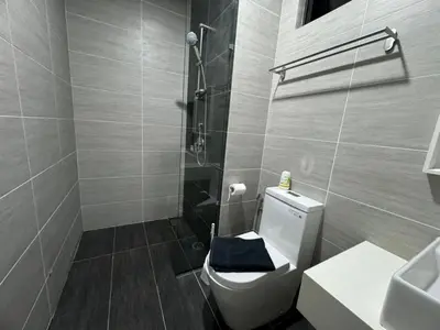 a bathroom with a toilet and a sink and a shower at TRION KL, Jalan Chan Sow Lin, Kuala Lumpur in Kuala Lumpur