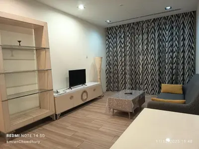 a living room with a tv and a couch at Binjai 8 KLCC BY Service Suites in Kuala Lumpur
