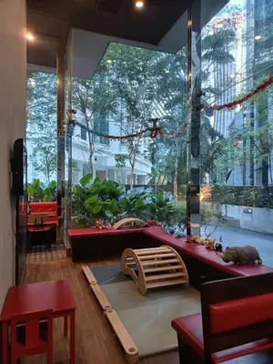 a room with a table and a large window at Binjai 8 KLCC BY Service Suites in Kuala Lumpur