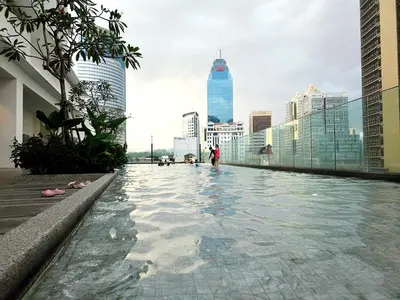 a swimming pool on the roof of a building at Aurelia Suites Quill Residences in Kuala Lumpur