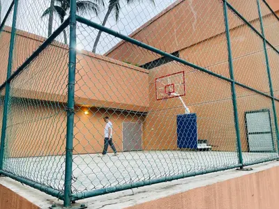 a man walking in front of a basketball hoop at Aurora Suites BUKIT At Times Square in Kuala Lumpur