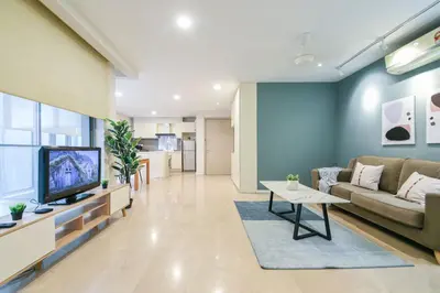 a living room with a couch and a tv at Fairlane Residence near Bukit Bintang KL in Kuala Lumpur