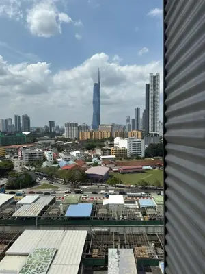 a view of a city with a tall building at TikiiBunk Packers in Kuala Lumpur