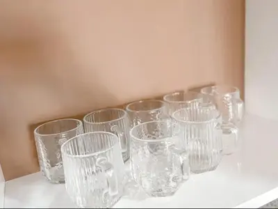 a group of clear glasses sitting on a table at Cozy Suites 2 to 5pax near Sri Hartamas Mont Kiara in Kuala Lumpur