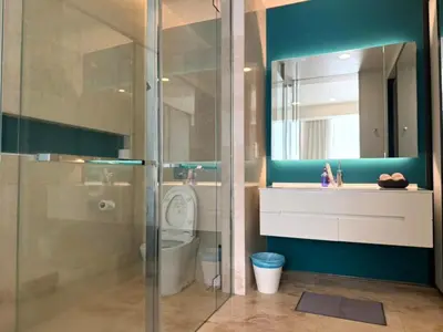 a bathroom with a shower and a toilet and a sink at Tropicana Residences CoolStay in Kuala Lumpur