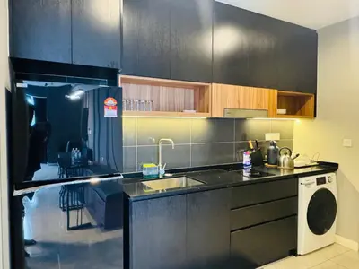 a kitchen with a sink and a dishwasher at Axon Residence KL Luxury Bukit Bintang in Kuala Lumpur