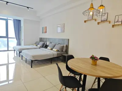 a living room with a bed and a table at 02 Kuala Lumpur KL Mid Valley The Garden 9Seputeh Vivo Soho 4PAX in Kuala Lumpur